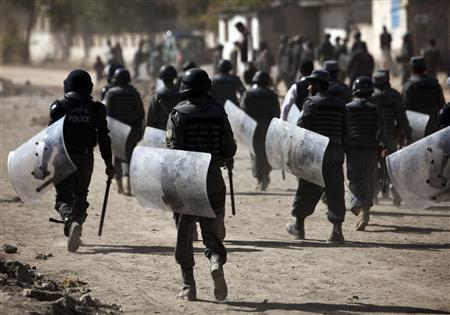 Afghan anti-riot police secure a protest in front of the parliament building in Kabul October 25, 2009_