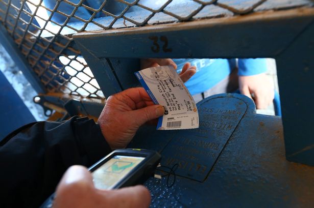 Fans+purchase+tickets+at+turnstiles+